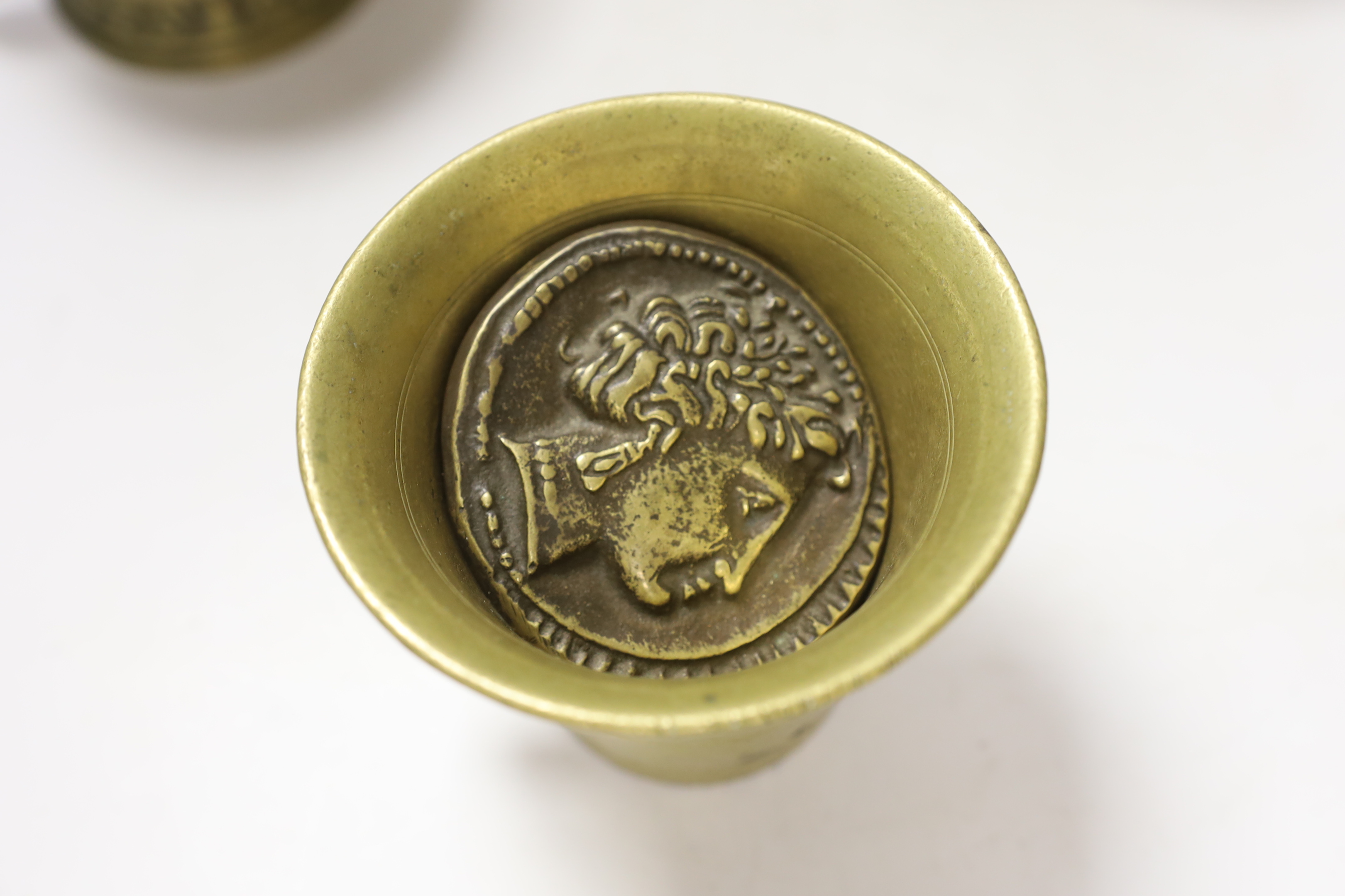 Three bronze / brass mortars and two pestles and a medallion